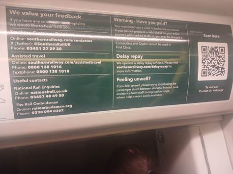 A sign with white text and black text

Description automatically generated